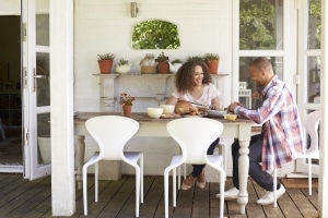 couple at home eating outdoor meal together PK7B8TL